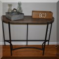 F09. Demilune console table. 30"h x 44"w x 15"d 
